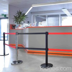 Custom retractable belt barriers such as this cost-effective ADA compliant dual belt stanchion make visitor management easier