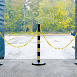 2.5 inch Diameter Plastic Crowd Control Striped Stanchion In A Warehouse
