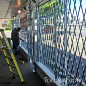 A scissor gate provides an extra layer of security that includes great visibility and airflow at your business and storage. Call Todoos for great ideas!